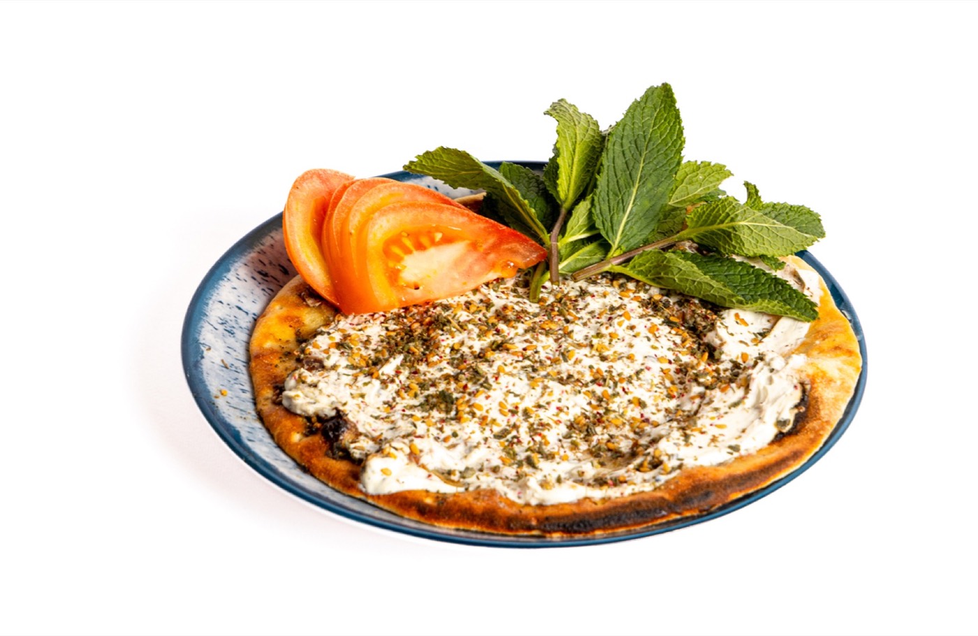 Manakish Habibi con pomodoro e menta fresca.